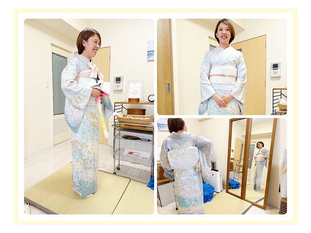 訪問着姿の生徒さん正面。淡い水色に桜のような柄が散りばめられた上品な着姿