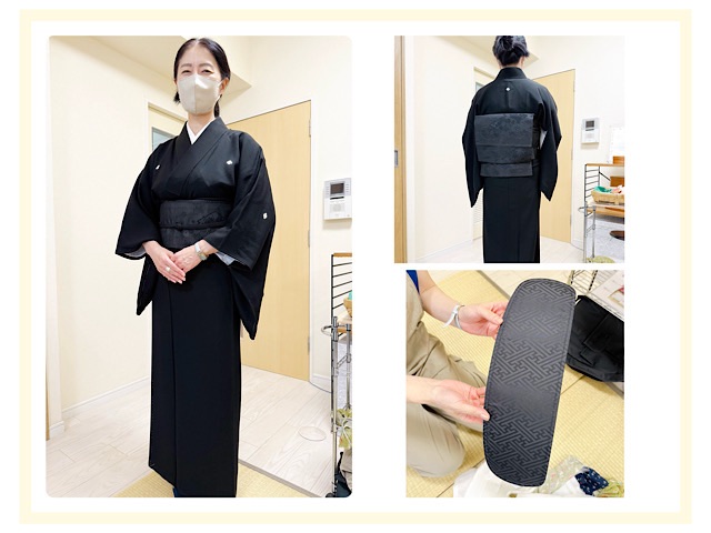 袷の五つ紋黒喪服を着た生徒さん。上品で端正な印象。後ろ姿は黒喪帯で二重太鼓を結び、紋がきれいに見えている。